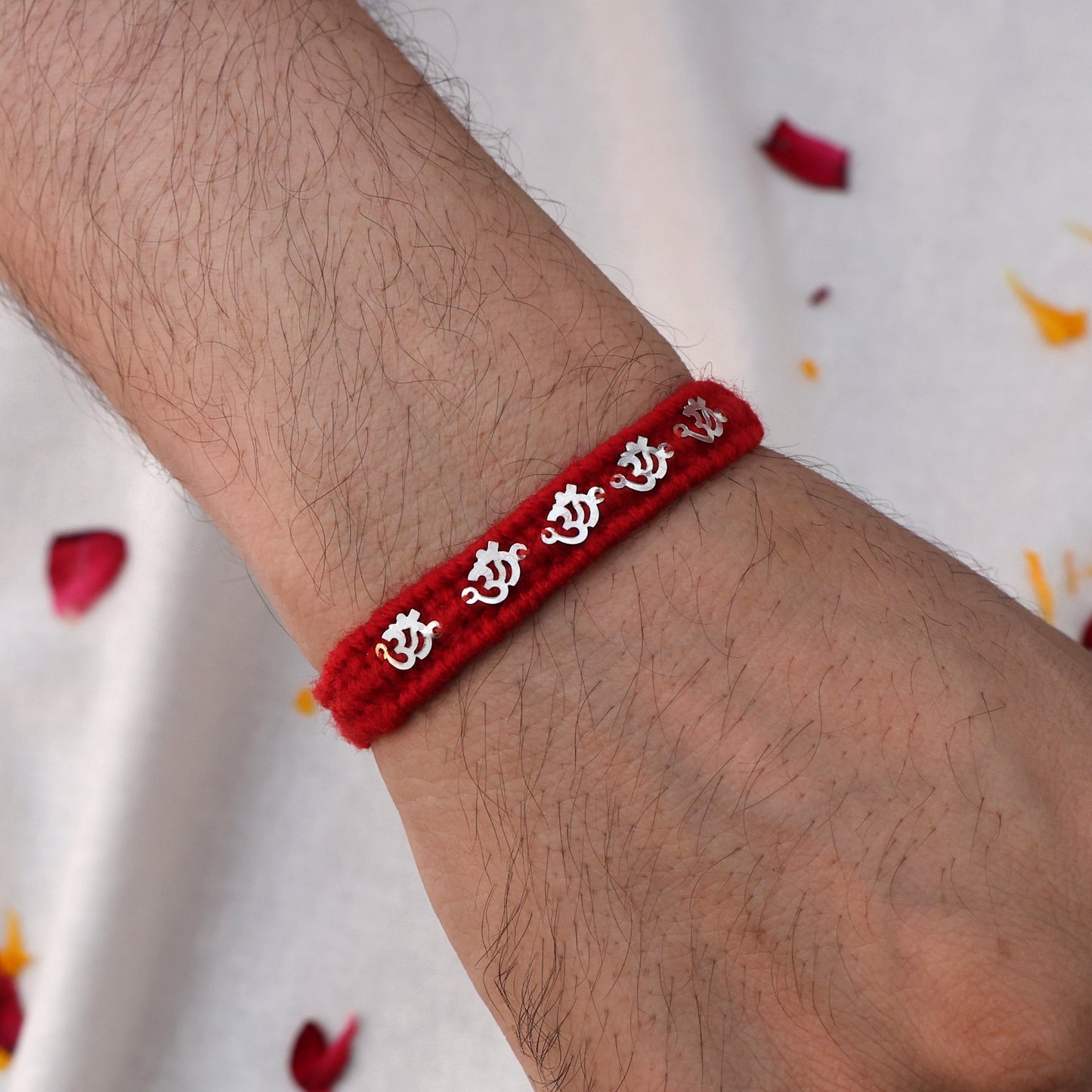 Silver Rakhi with Om Charm
