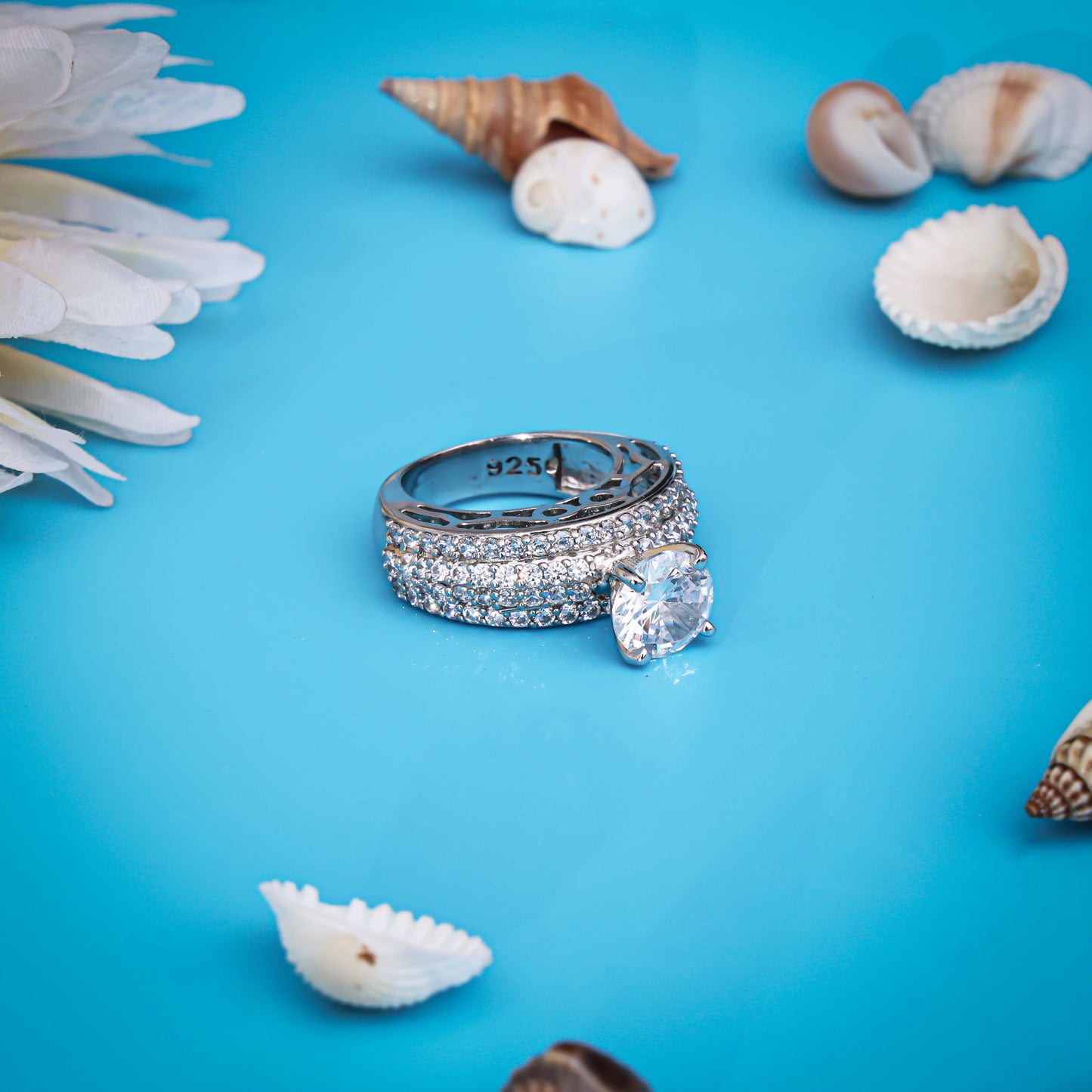 Silver ring with a bold, single white stone at the center for a striking look.
