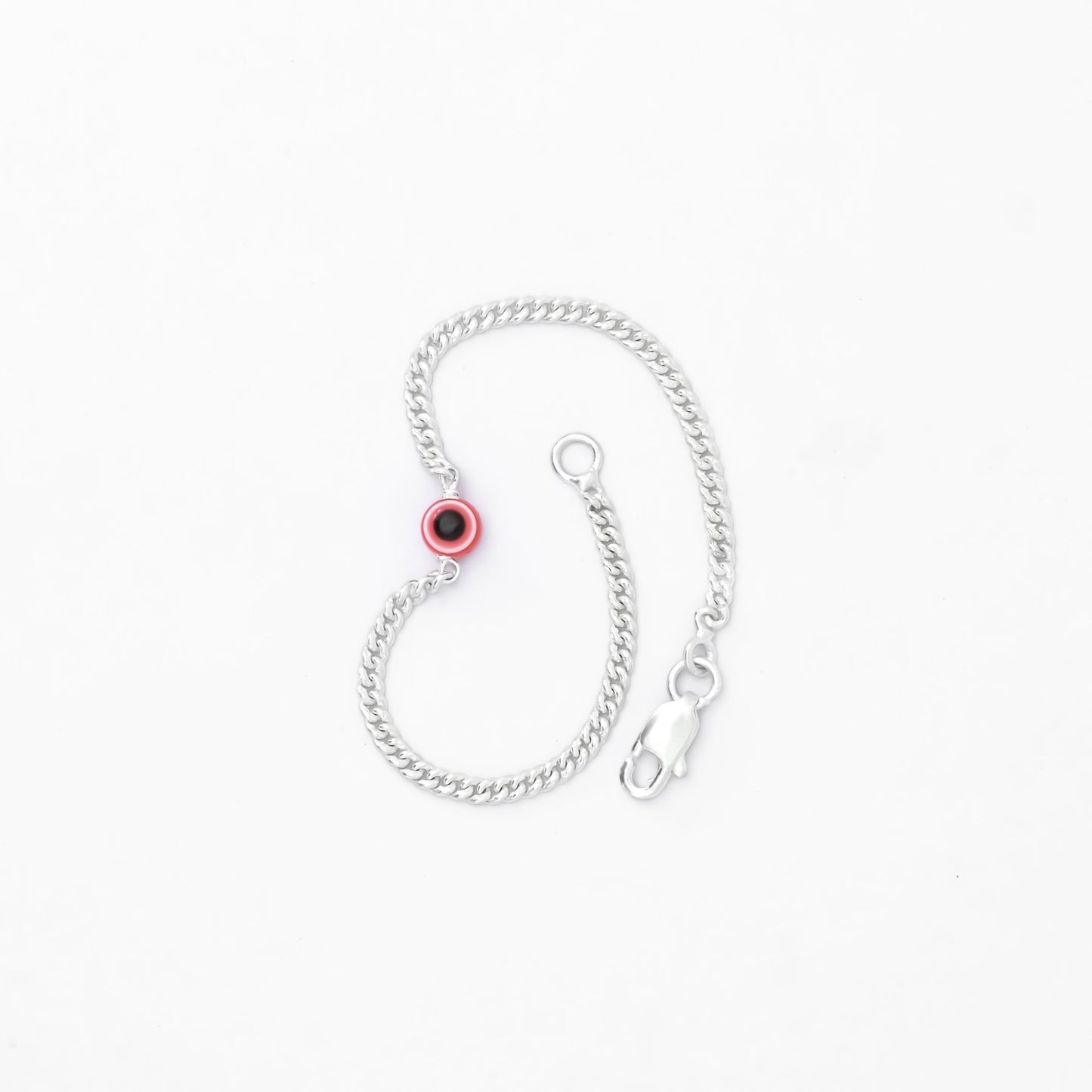 Stylish silver bracelet featuring an evil eye charm and soft pink hue.