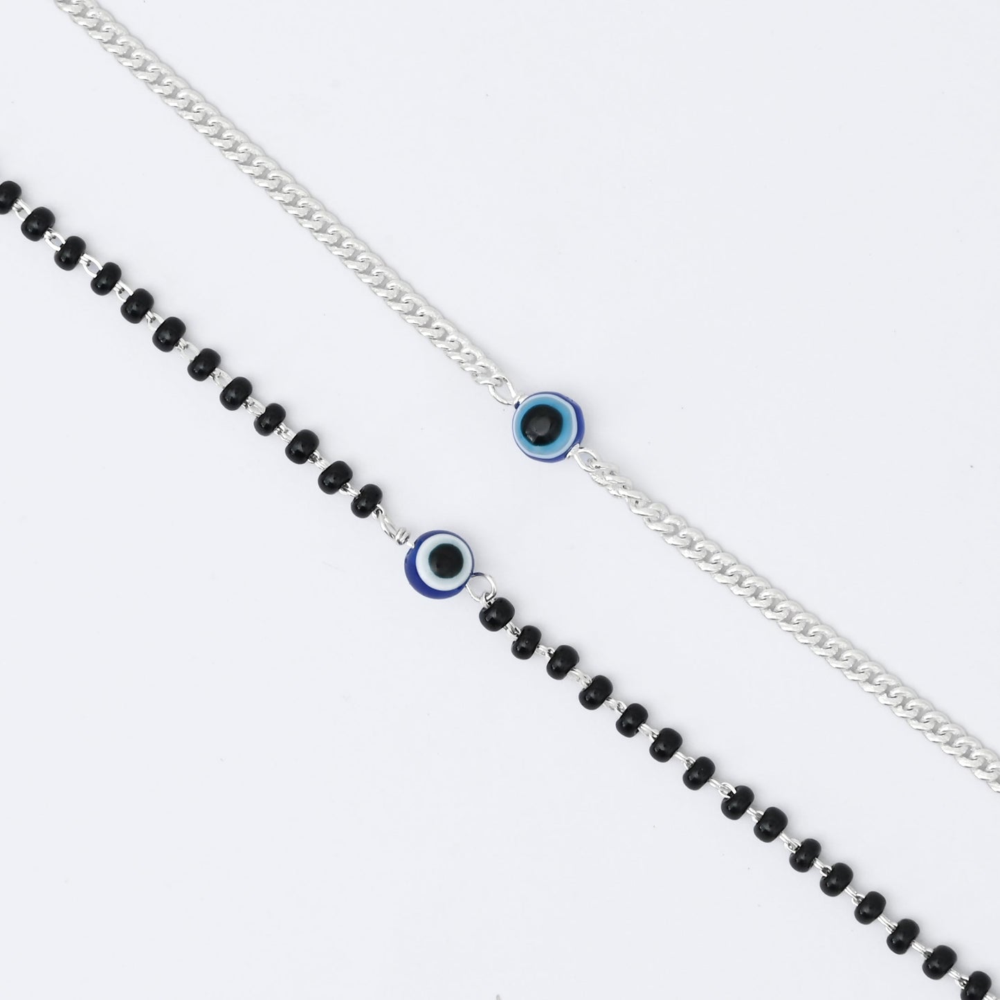 Couple's matching silver evil eye bracelets for men and women.
