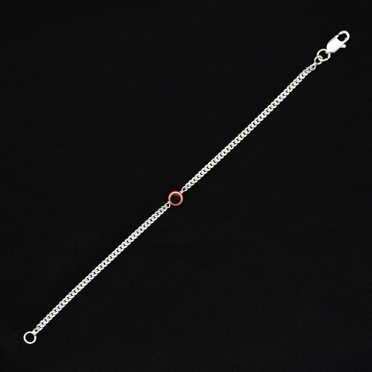 Trendy silver evil eye bracelet with a subtle pink tint for fashionable protection.