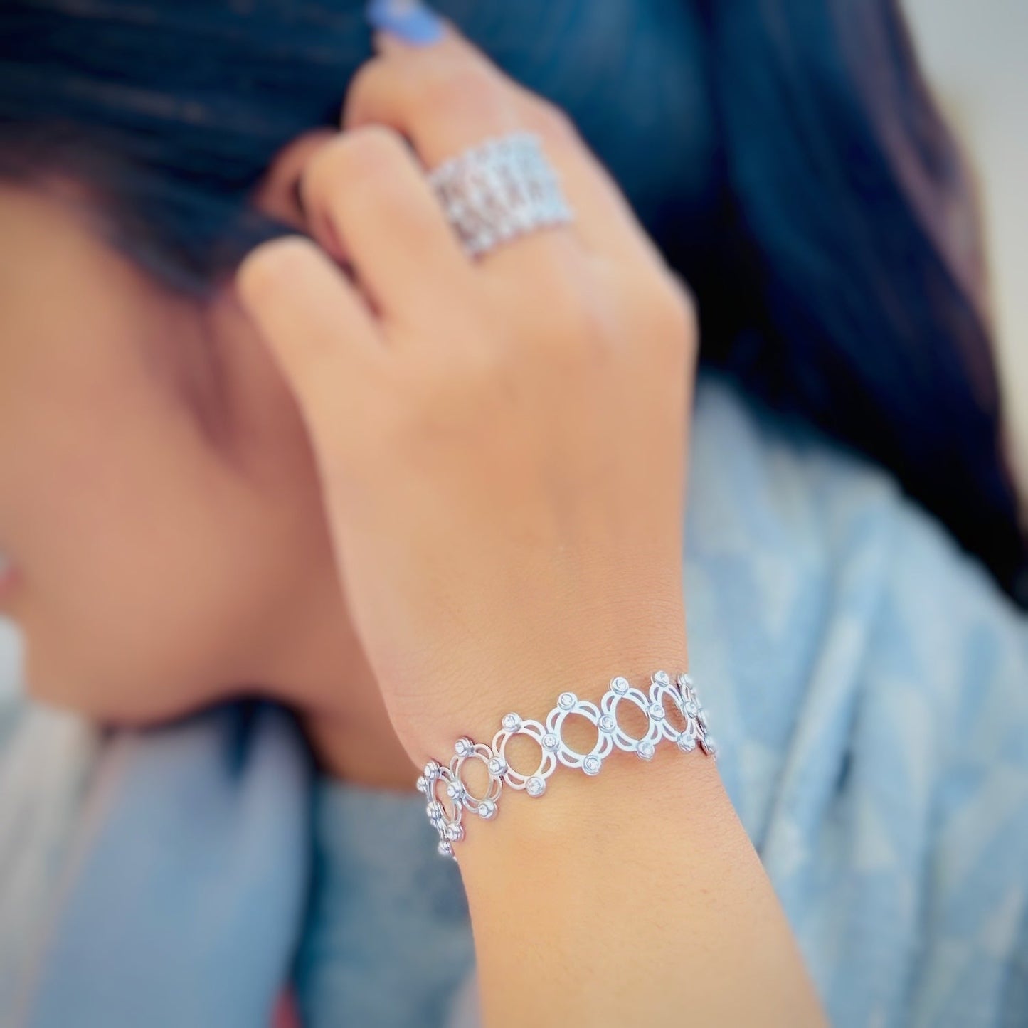 Convertible silver bracelet transforms into a stylish ring for any occasion.