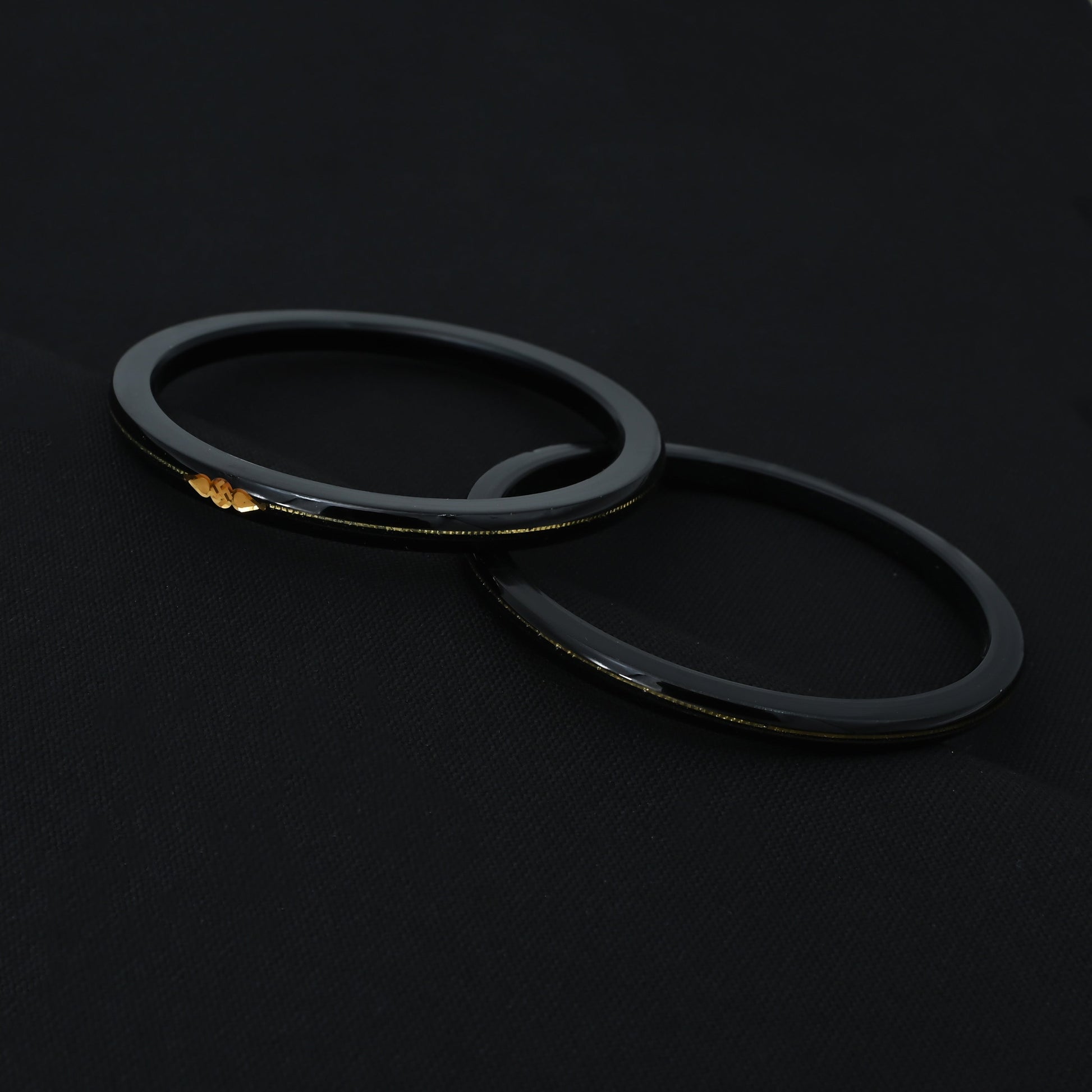 Silver Center Swathik Design Black Bangles