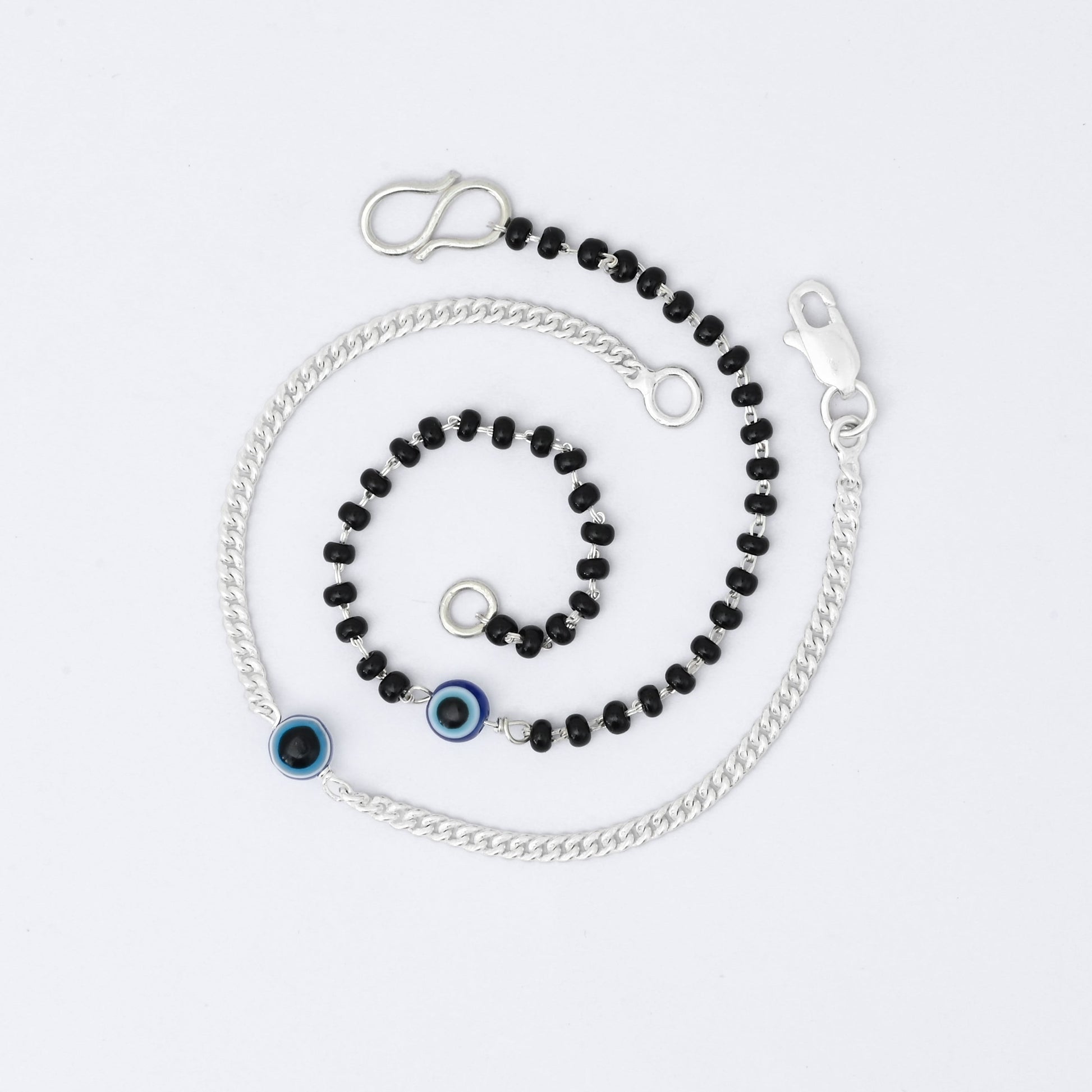 Elegant silver evil eye bracelet set for couples, stylish and protective.