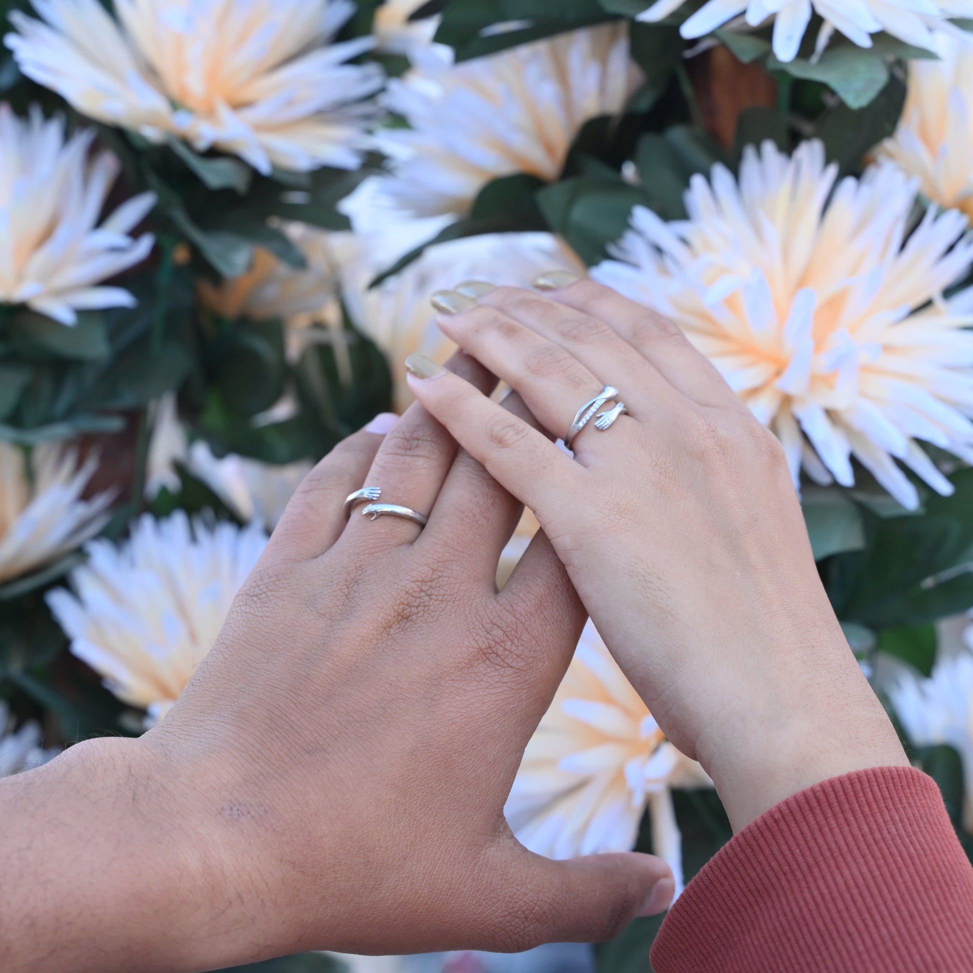 Elegant silver couple’s ring set with love hug design for him and her.